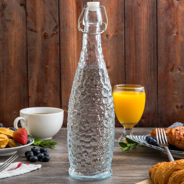 Acopa 32 oz. Textured Glass Water Bottle with Clear Swing Top Lid